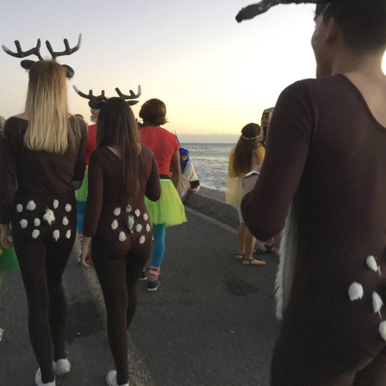 Poem "Explicit" - Poetry Podcast - Young people at a carnival parade by the sea